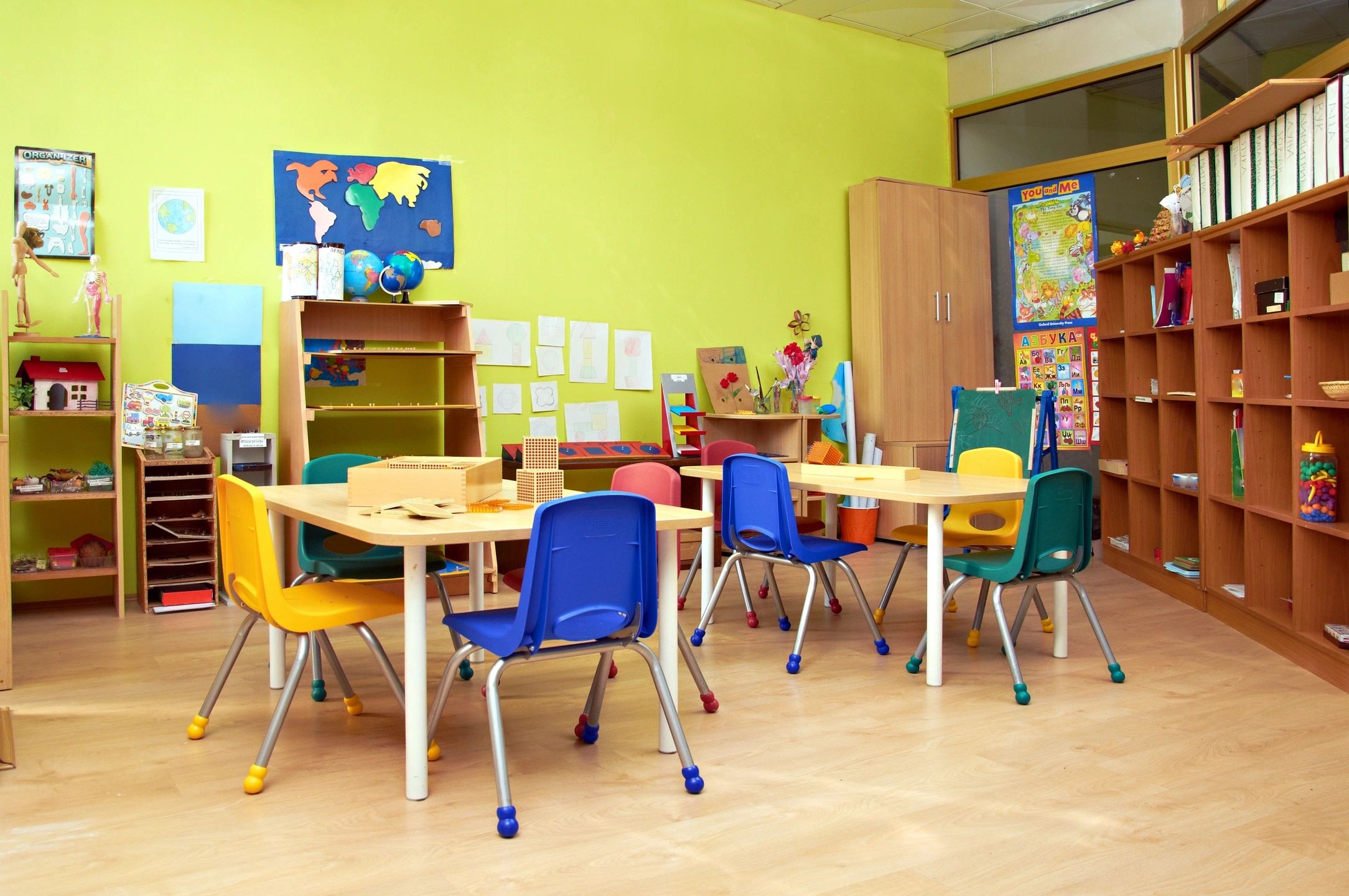 Diverse children learning together in a colorful preschool classroom